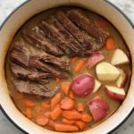 roast, carrots and potatoes in a dutch oven.
