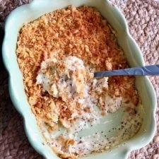poppy seed chicken casserole in a green dish
