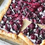 blackberry cheese danish pastry on a sheet pan.