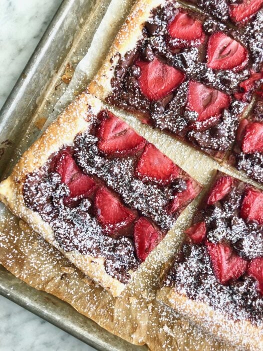 chocolate strawberry tart on a sheet pan