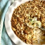 broccoli cheese casserole in a white dish