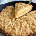 cheesy cornbread in a cast iron skillet