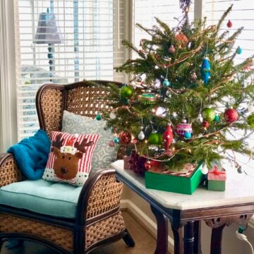 small tree decorated with shiny green and blue ornaments for a southern Christmas.
