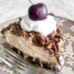 slice of frozen mocha latte pie with a fudge brownie crust.