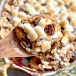 loaded sweet potato casserole with marshmallows and pecans.