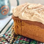 loaf of pumpkin bread with frosting on top