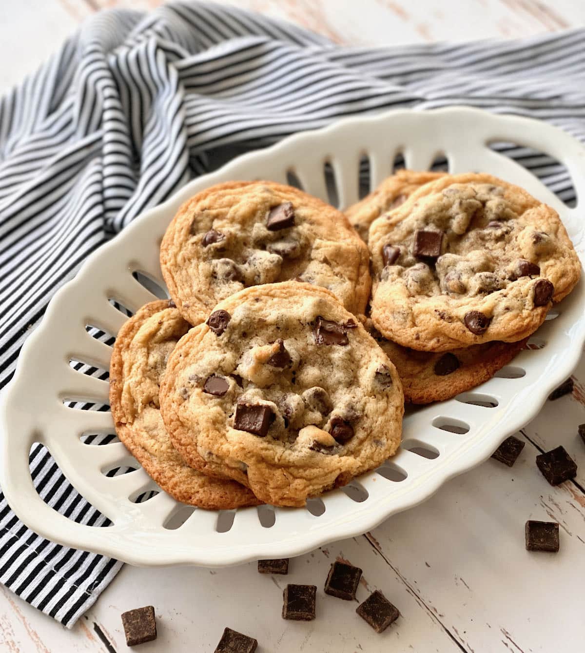chocolate chip cookies on a white plate.