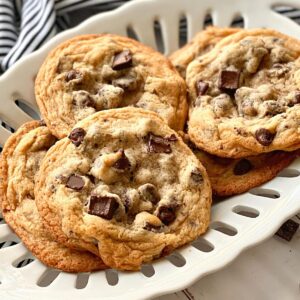 ultimate chocolate chip cookies on a white dish.