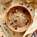 a wooden bowl filled with dry rub for corned beef.