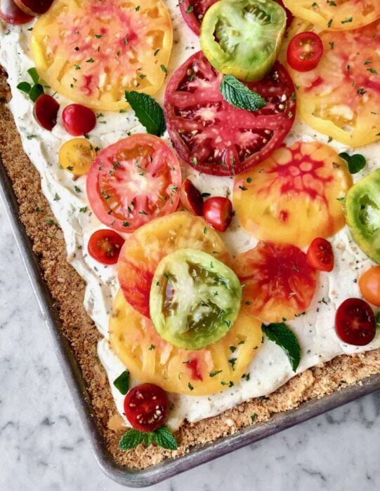 diagonal view of sheet pan with tomatoes.