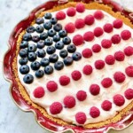 American flag pie decorated with blueberries and raspberries.