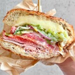 grinder salad sandwich showing meats, cheeses and salad.