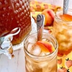 homemade peach iced tea with simple syrup in glasses.