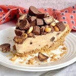 Reese cups on top of a slice of peanut butter pie.
