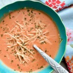 fire roasted tomato soup in a blue bowl.