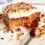 slice of pumpkin pie dump cake with a fork.