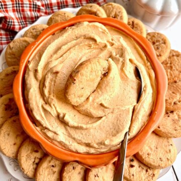 pumpkin cream cheese dip with cookie dunking into it.