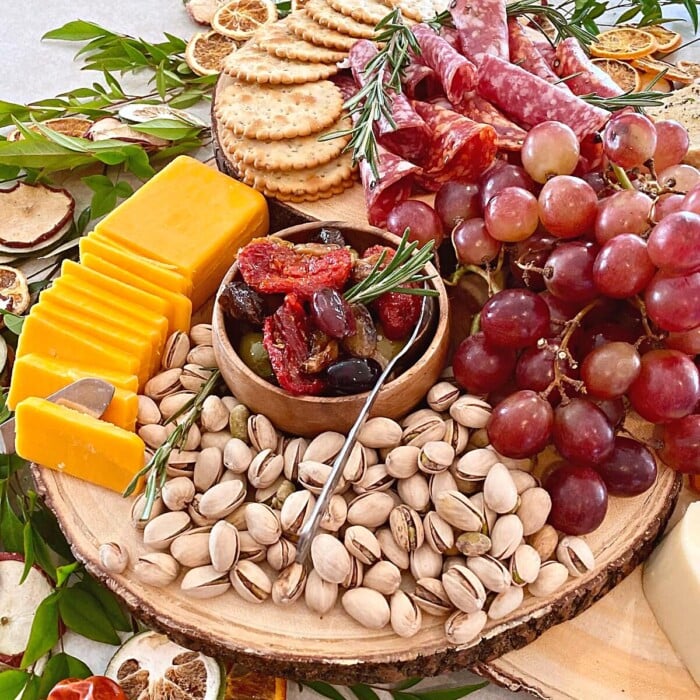 fall charcuterie board featuring meats and cheeses.