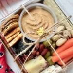 Individual charcuterie grazing box tied with twine.