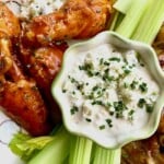 Pan fried chicken wings with blue cheese dip.