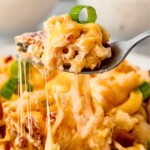 Cheesy Crack Chicken Casserole pulled up by a fork.