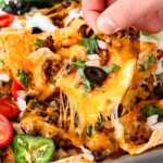 Loaded Nachos with an epic cheese pull.