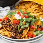 Plate loaded with Walking Taco Casserole featuring Fritos corn chips.