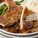 Plate of oven baked bone-in pork chops.