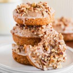 Pumpkin spice donuts with maple glaze and pecans.