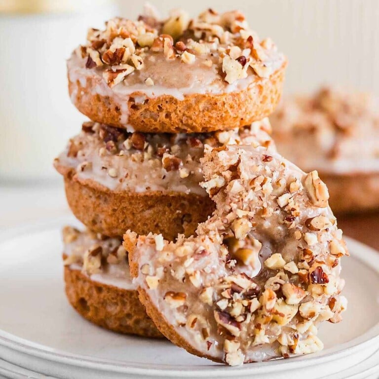 Pumpkin spice donuts with maple glaze and pecans.