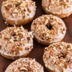 Pumpkin spice donuts with pecans.