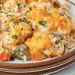 Chicken broccoli rice casserole piled with cheese.