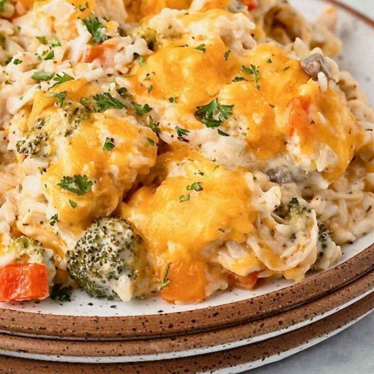 Chicken broccoli rice casserole piled with cheese.