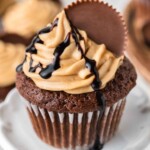 Chocolate Peanut Butter Cupcakes with a chocolate drizzle and peanut butter cup.