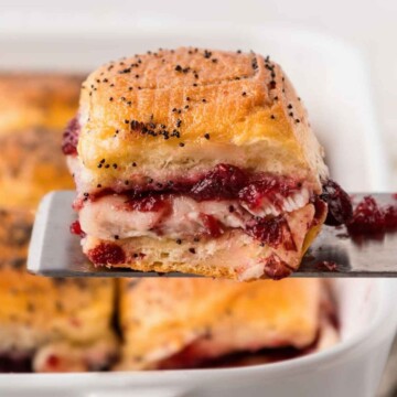 Cranberry Turkey Sliders ready to serve on a spatula.