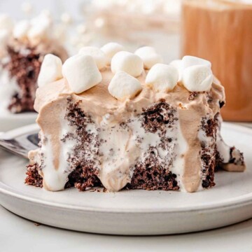Hot Cocoa Poke Cake with marshmallows on top.