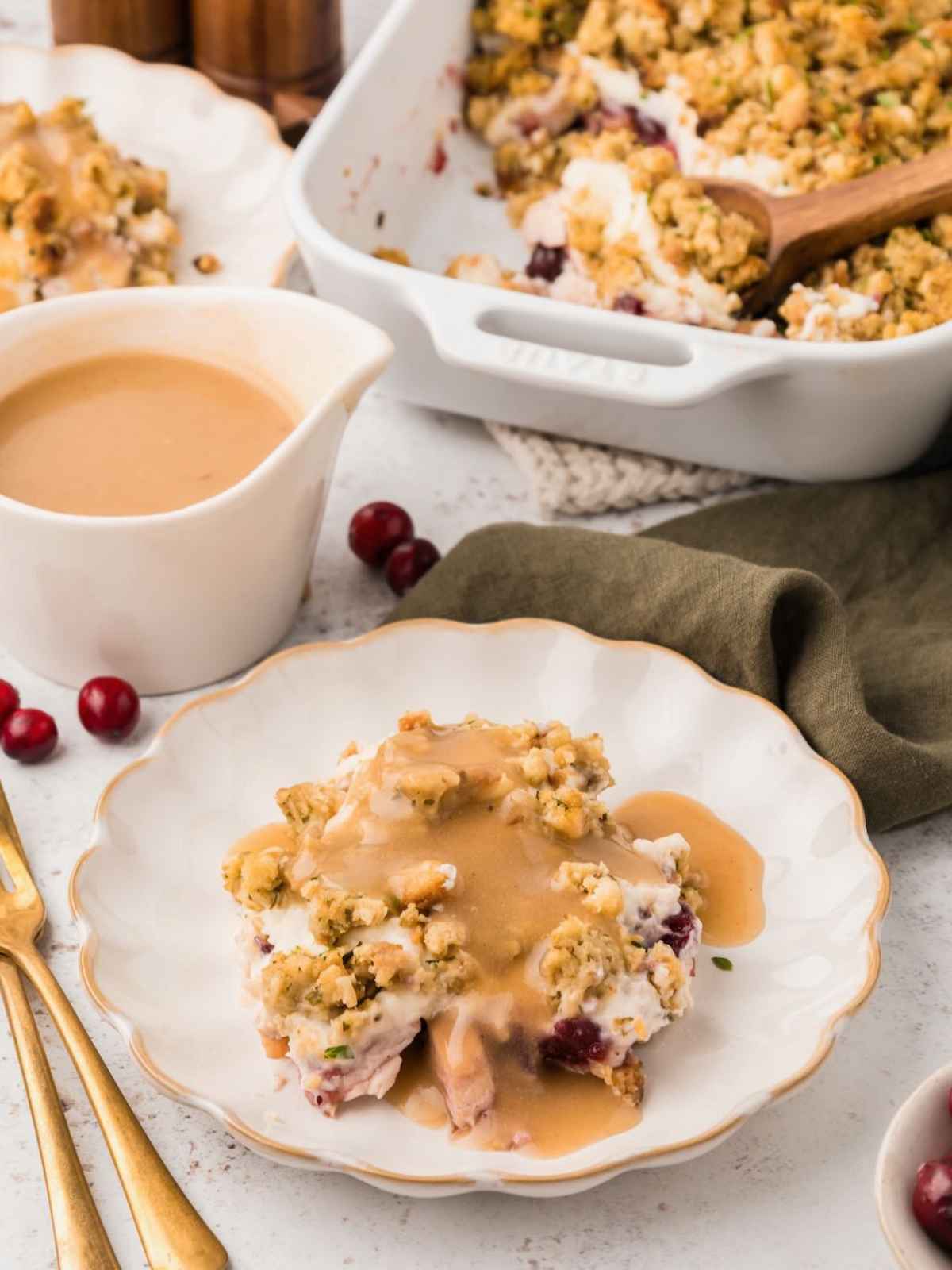 Leftover turkey casserole on a plate with gravy.