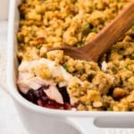 Scoop of turkey casserole in white dish.