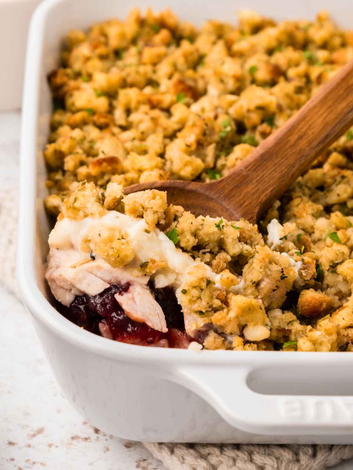 Scoop of turkey casserole in white dish.