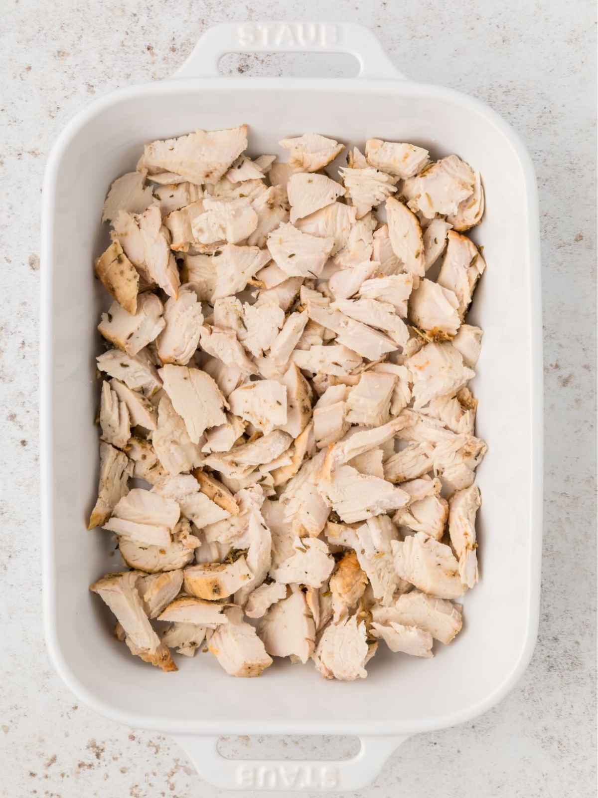 Turkey layered in bottom of dish.