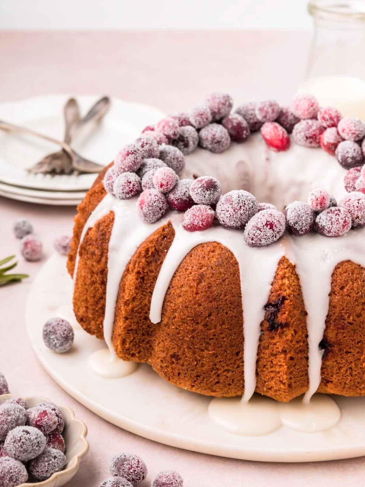 Orange cranberry bundt cake on a cake plate.