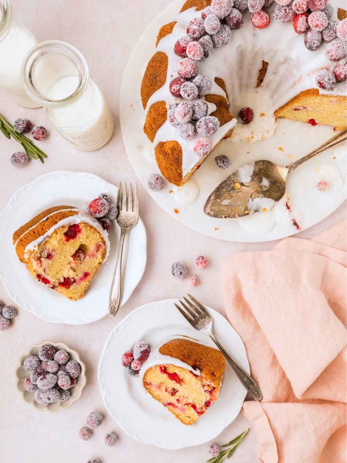 Serving cranberry bundt cake on plates.