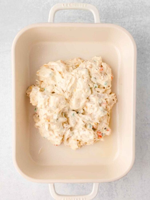 Chicken mixture spread in baking dish.