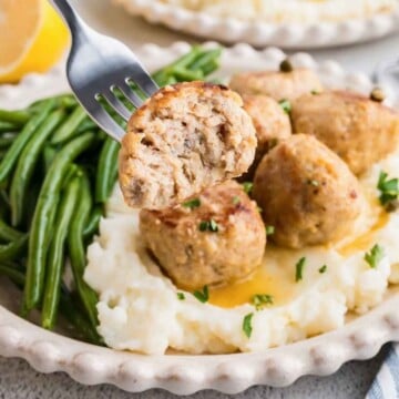 Chicken Piccata Meatballs served with green beans and mashed potatoes.