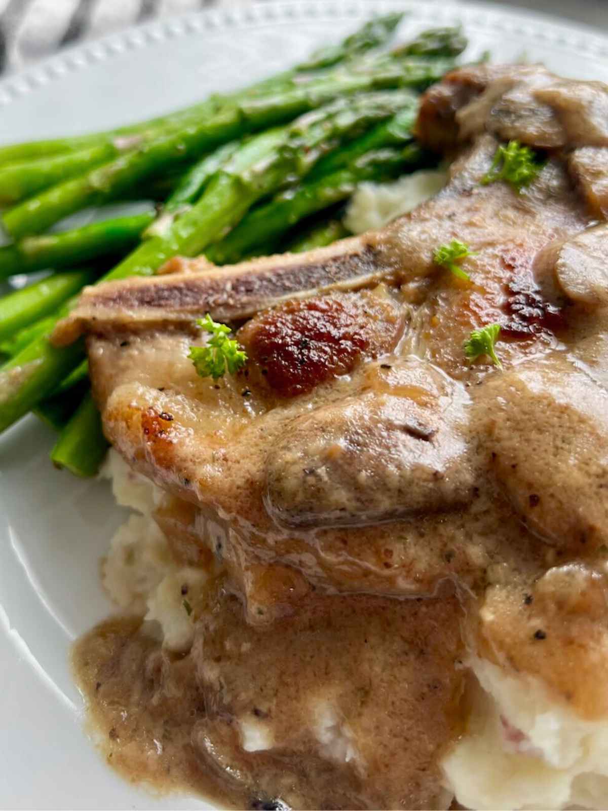 Mushroom gravy drizzling down mashed potatoes.