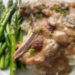 Mushroom gravy over pork chop on mashed potatoes.