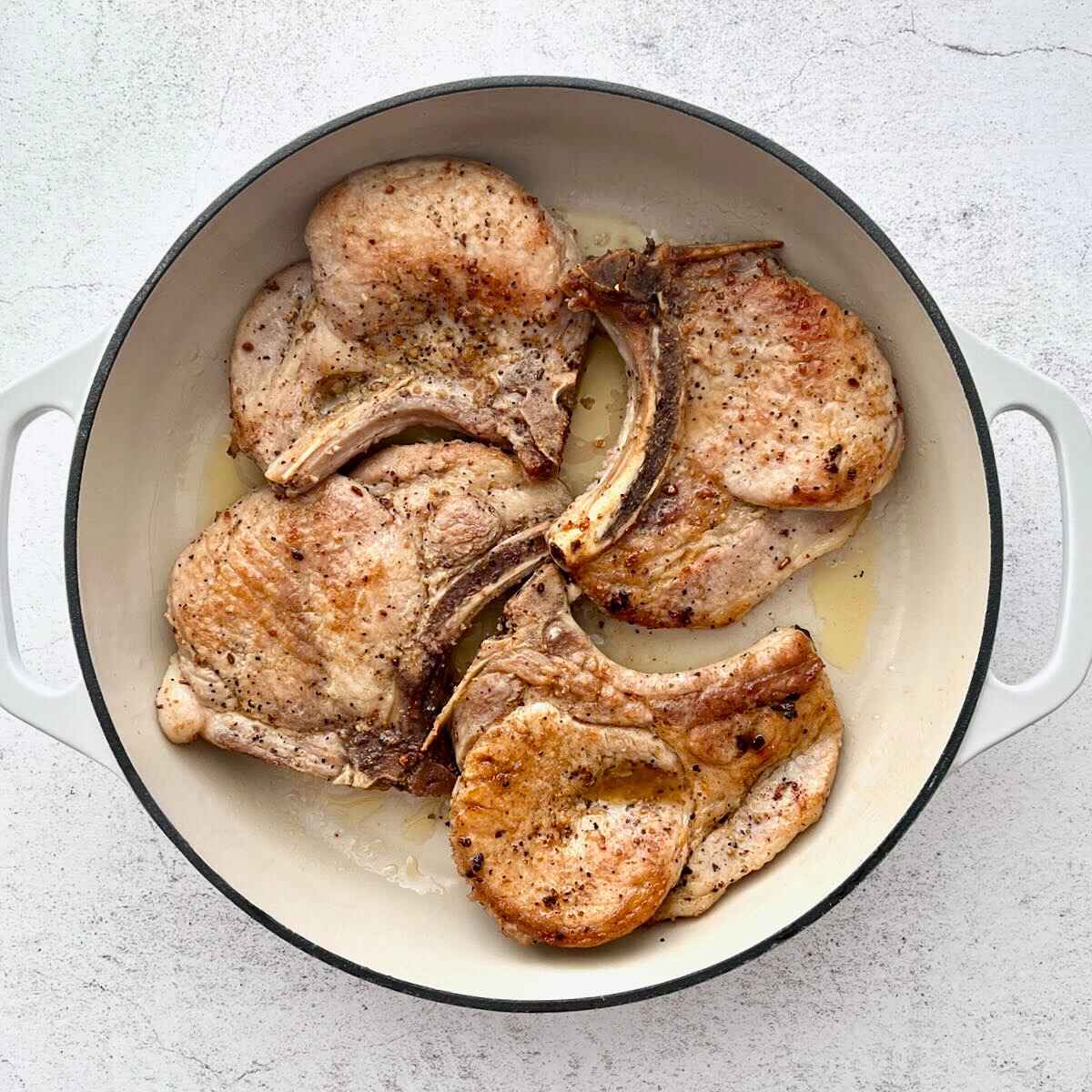 Pork chops after being seared in dutch oven.