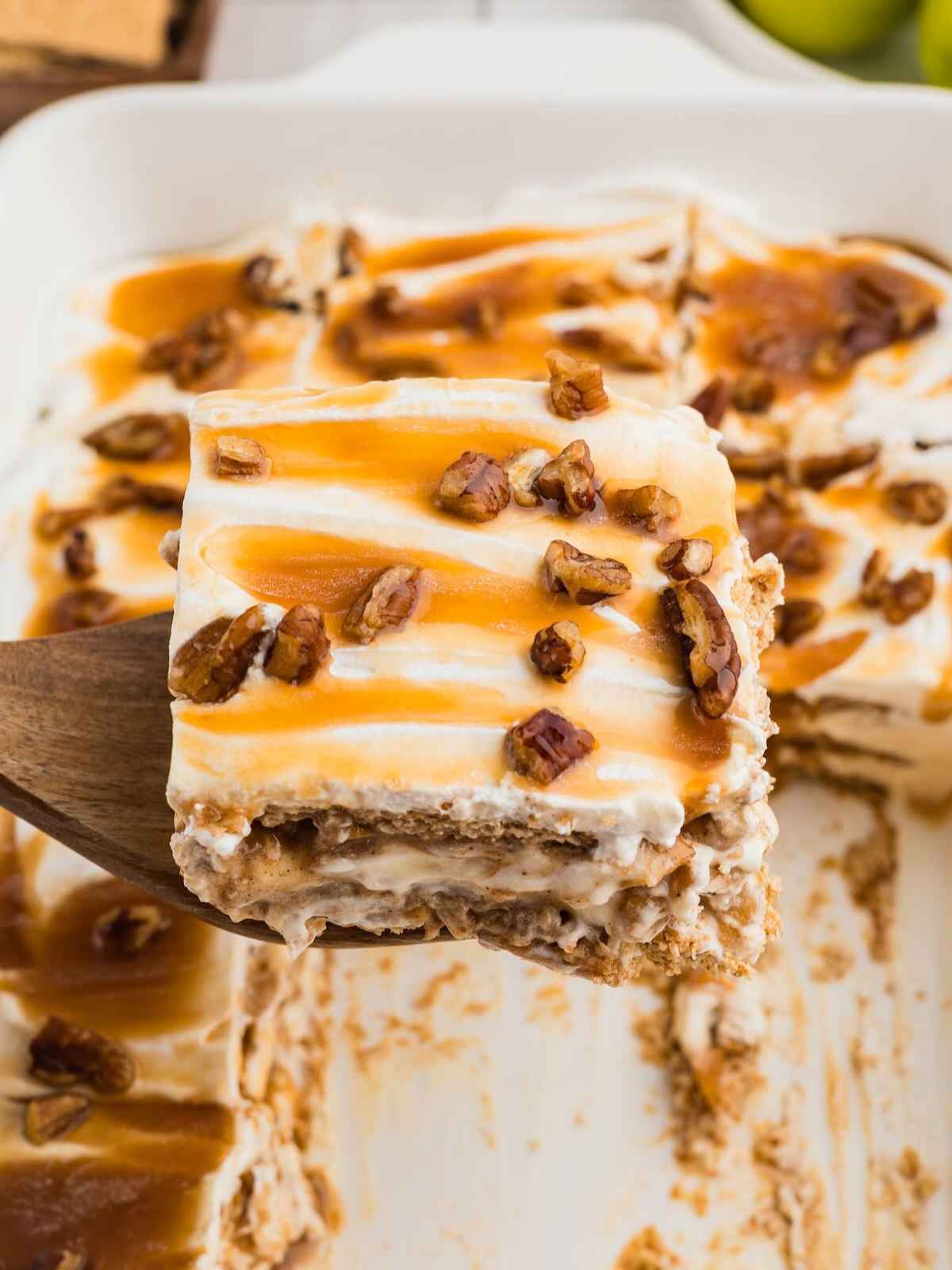 Caramel Apple Eclair Cake on a spatula.